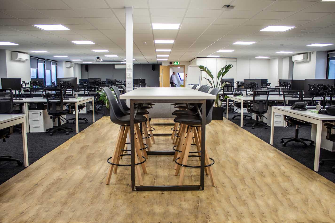 Bright, clean open-plan office with desks and meeting space